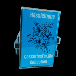A blue cassette tape of the band Hassleinone